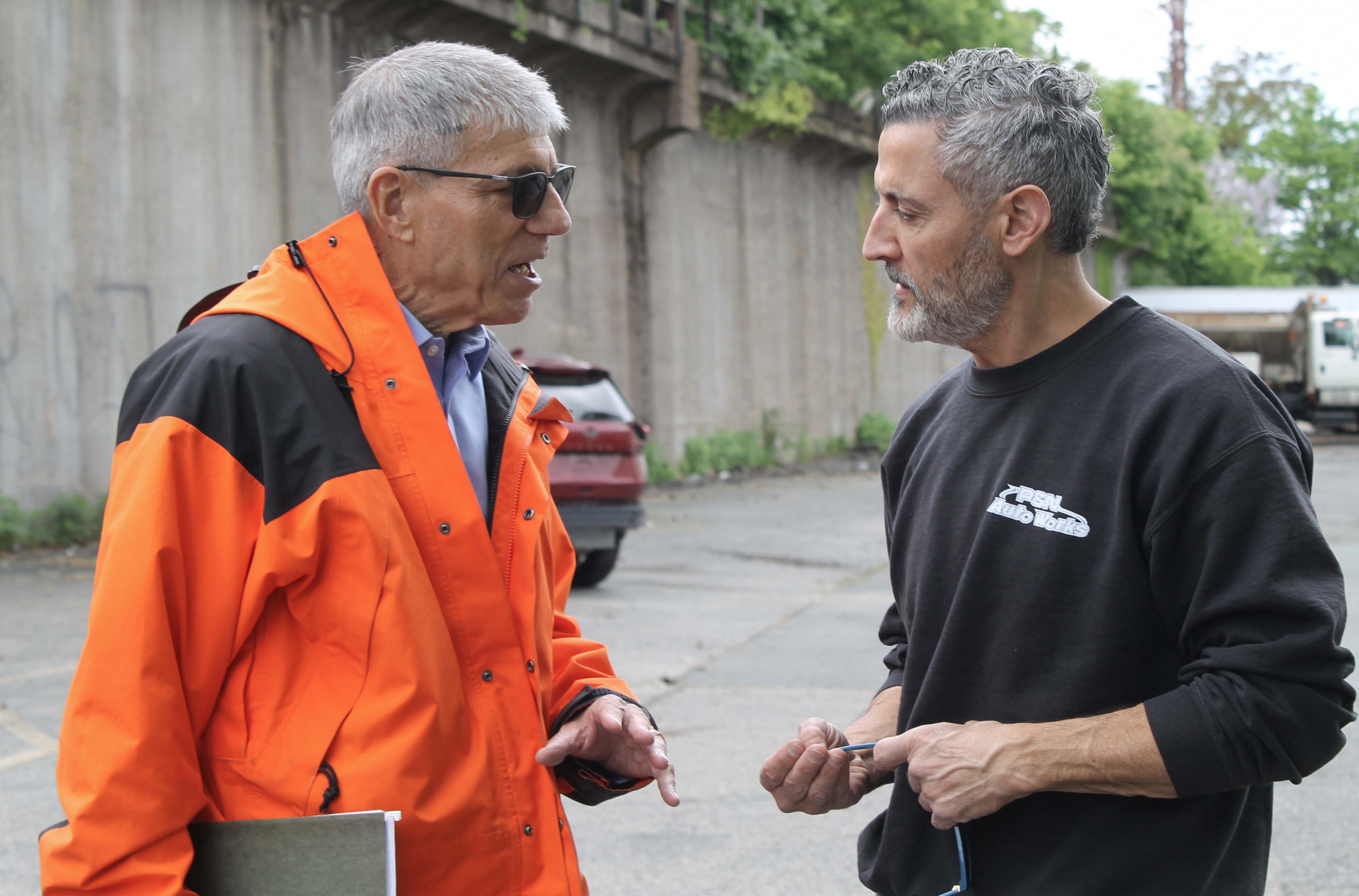 Larry Poster speaking with the owner of PSN Auto Works